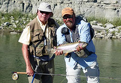 Photo of Ben Taylor (left), with his trout and guide in Alberta, Canada, says he was “born to fish.”.
