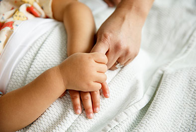 Photo of a child and mother holding hands. Links to Gifts of Cash, Checks, and Credit Cards. cash.jpg