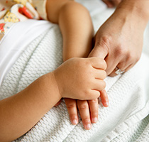 Photo of a child and mother holding hands. Links to Gifts of Cash, Checks, and Credit Cards.